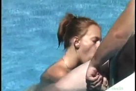 Milf gives blowjob on big hard cock outdoors in pool