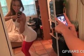 Teen seductress working pussy in the mirror