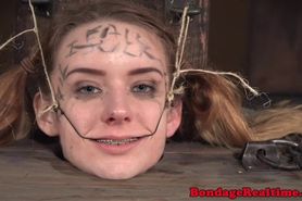 Petite whore restrained by her femdom master