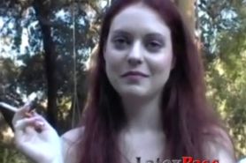 Redhead smoker tries out latex behind the scenes