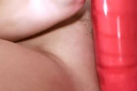 horny brunet with luxury red dildo