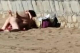 Couple have sex on busy beach