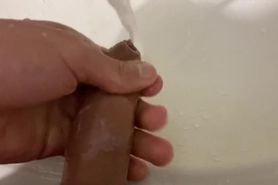 Hot boy washs the head of his cock at public toilet at restaurant