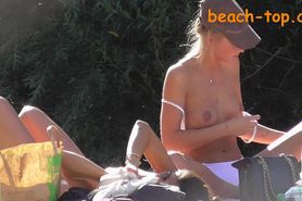 Girls topless on the beach