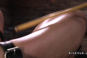 Brunette slave gets anal hook in dungeon