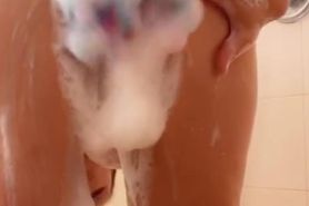 Hot milf with big boobs getting off in the shower
