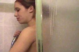 Hot girl with great tits takes a shower.
