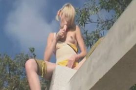 Blonde girl playing with vibrator
