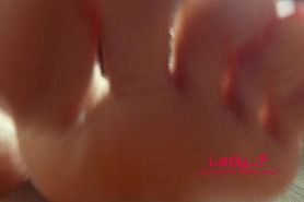 Mistress shows beautiful feet with long toes with red nails, Lady Footfetish soles