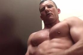 muscle daddy jacks out a load in the bathroom at work