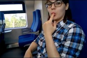 A playful girl in a train