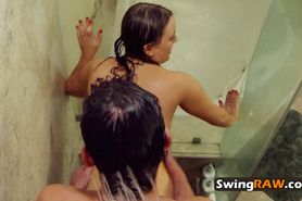 Couple steams things up in the showers before meeting other swingers