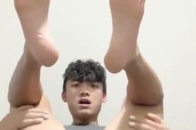 Asian boy shows off hole