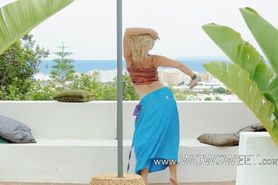 attractive blonde making outdoor strip