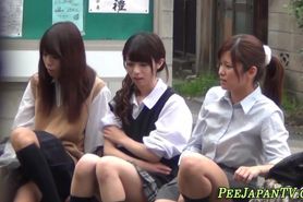 Cute japanese teens in uniform peeing