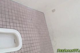 Oriental skank peeing in toilet