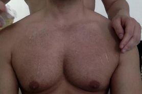 Getting my pecs oiled and worshipped