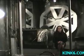 Girl on the wheel of pain