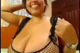 Latin MILF with big breasts and booty teasing