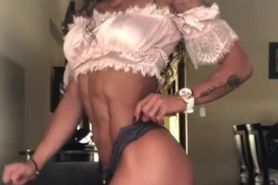 Fitness teen Katherine Zuluaga posing and flexing her abs