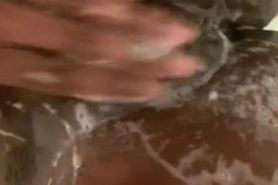 Young black teen rubs her ass and plays with pussy in shower