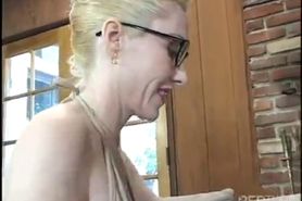 Blond MILF stockings glasses couch bang