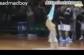 Cheerleader removes her top during a basketball game