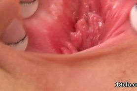 Lovable teenie is gaping soft twat in closeup and getting off