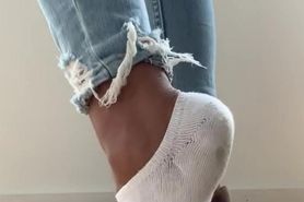 Sexy girl in stinky smelly dirty white socks and hot sneakers