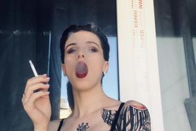 hot girl in red lipstick smoke on the balcony only in bra