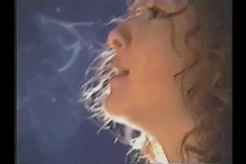 Brunette teen with curly hair smoking