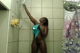Sexy black chick with natural ass enjoys a morning shower