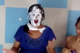 Woman gets her head stuck in a cardboard box and then pied in the face