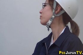 Asian worker wets herself and pee soaks pants