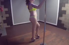 Redhead pole dancing in bra and thong