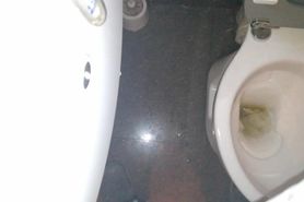 hidden camera at a Chinese restaurant, he pisses all over the toilet.