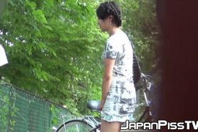 JAPAN PISS TV - Tantalizing Japanese girl peeing in front of someone bicycle