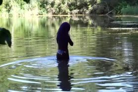 latex girl in a lake