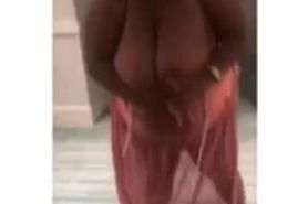Sexy black bbw walking and swinging enormous boobs in the hotel hallway