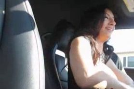 Busty shows her tits while she is driving