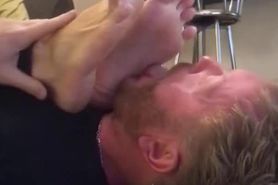 Foot slave licks his younger masters sweaty feet