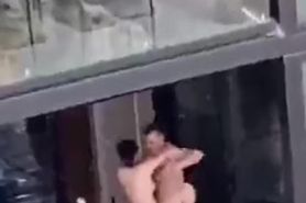 White Couple sex on balcony in broad daylight