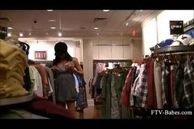 Brunette amateur dares to rub her cunt in a clothing store