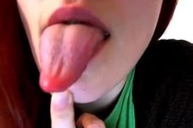 Sexy redhead teen shows what she can do with her tongue