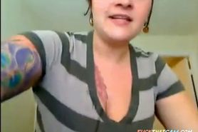 big titted tattooed babe throatfucks herself