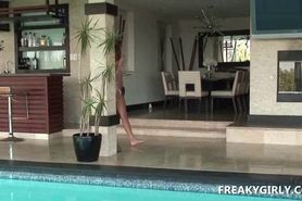 Cutie strips and masturbates with vibrator by the pool