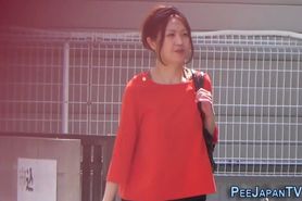 Asian teen pees in public