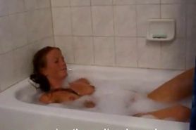 Skinny Brunette strips and masturbates in bathtub