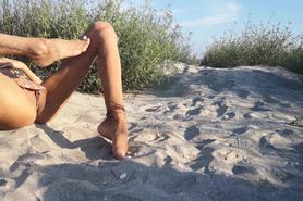 French nudist teen hides at the beach and plays with her tanned petite body