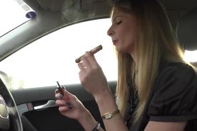 Girl smokes cigar while driving